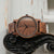 Holzkern Rilke Armbanduhr aus Nussbaumholz mit rundem Gehäuse und Holzarmband.