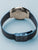 Bering Herrenuhr Rückseite mit blauem Milanaise-Armband und Edelstahlgehäuse