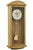 Wooden wall clock with round dial and swinging pendulum, oak finish