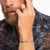 alt
A silver ring with a detailed engraving of a dragon, set with a black stone.