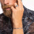 alt
A silver ring with a detailed engraving of a dragon, featuring a central blue stone.