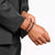alt
A silver ring with a black stone and intricate details.