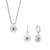 Jewelry set with necklace and earrings: round sunburst pendant with blue stone