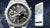 Edifice Herrenuhr neben Smartphone mit Karten-Display