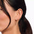 Gold-plated waterfall earrings with white stones