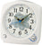 Weißer analoger Seiko Wecker mit blauem Blumen-Zifferblatt, Sekundenzeiger und zwei Reglern