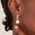 ANIA HAIE E043-04G Creole earrings with oval pearl pendant and zirconia stone