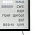 LED wall clock cutout with silver word field and illuminated time words, black framed.