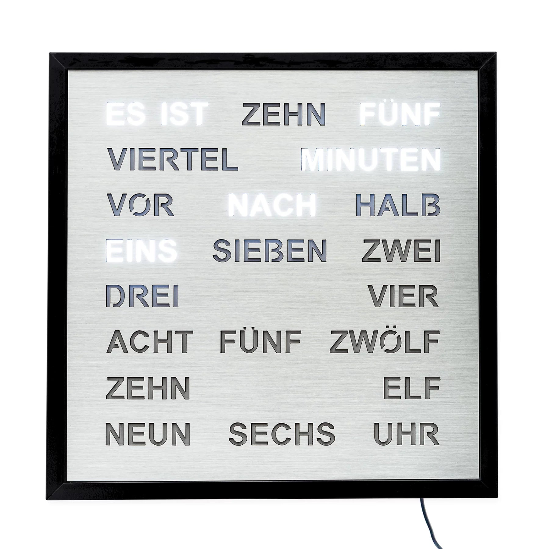 LED wall clock with silver word field, black frame, and illuminated time word layout.