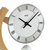 Table clock with round wooden frame in beech, white dial, Roman numerals, and pendulum