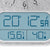 Wall clock with analog dial and digital display for time, temperature, and humidity
