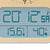 LCD display of the wall clock with blue digit display: time, °C and %
