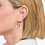 Gold-coloured, classic hoop earrings, with a rounded, slightly wider shape - Thomas Sabo model: CR745-001-21