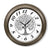 Wanduhr mit braunem Metallgehäuse, weißem Zifferblatt und Baum-Motiv