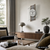 AMS Heidelberg Wanduhr mit rundem Zifferblatt und Glasfront an Holz-/Steinplatte