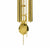 Gold-colored bell with chains and metal strips of the wall clock