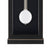 Detail view: round glass pendulum weight in black clock case