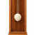 Wooden grandfather clock with pendulum bob on the front of the closed door