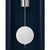 Wall clock detail: round weight element and suspension on the pendulum rod