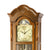 Walnut grandfather clock with visible dial, Roman numerals, and pendulum movement
