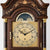 Grandfather clock dial with moon phase display and Roman numerals