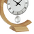 Table clock with beige wooden case, white dial, Roman numerals, and pendulum