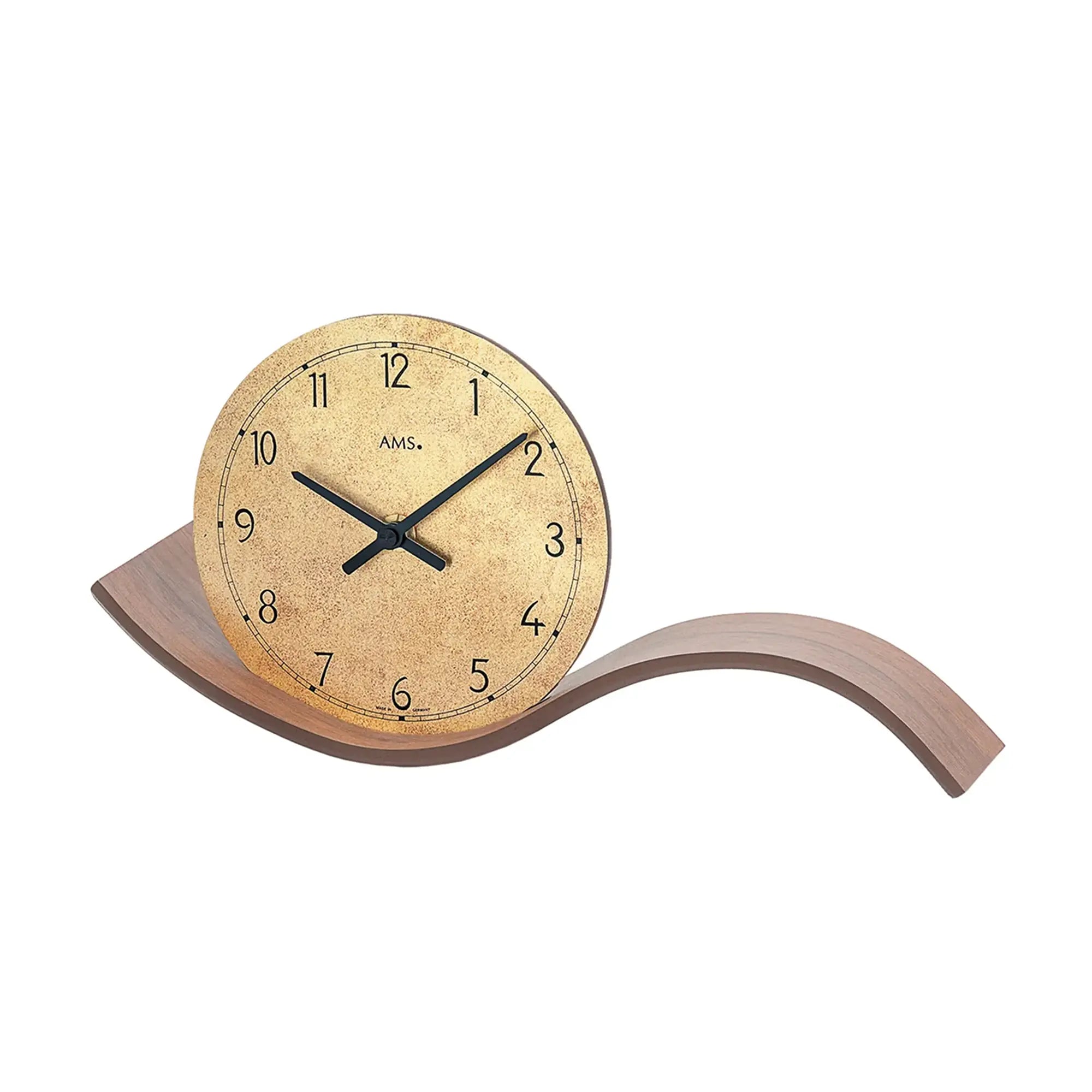 Table clock with walnut wood base, round dial, and black hands, set at an angle.