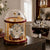 Table clock with gold-colored frame, white dial, and glass dome