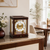 Mahogany table clock with glass front, gold dial, and Roman numerals