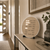 Round LED word display wall clock in wood look with illuminated text