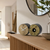 Table clock with wooden dial, round bird melody window, and black housing