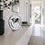 Metallic table clock with world map on white dial and black hands