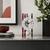 Skeleton table clock: white dial, black hands, red columns