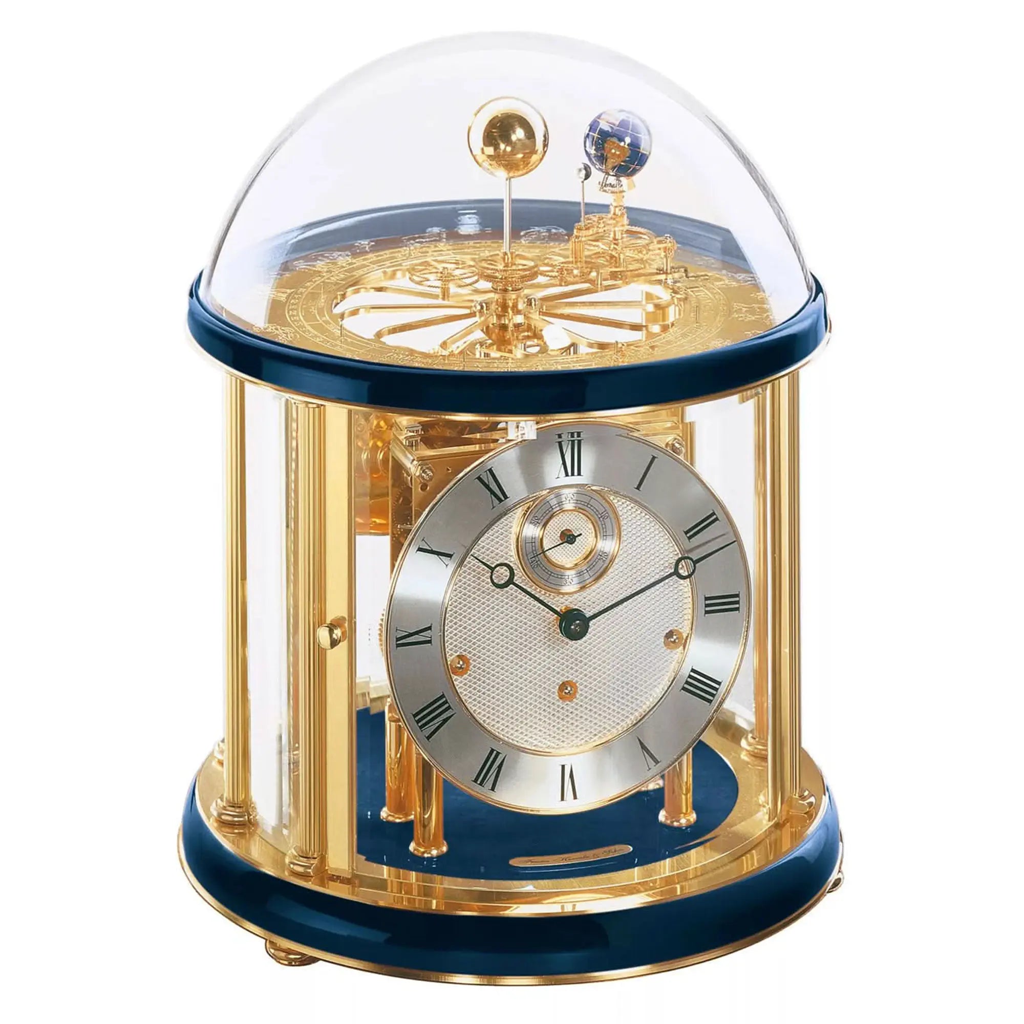 Mechanical table clock with glass dome, gold-colored frame, and blue base