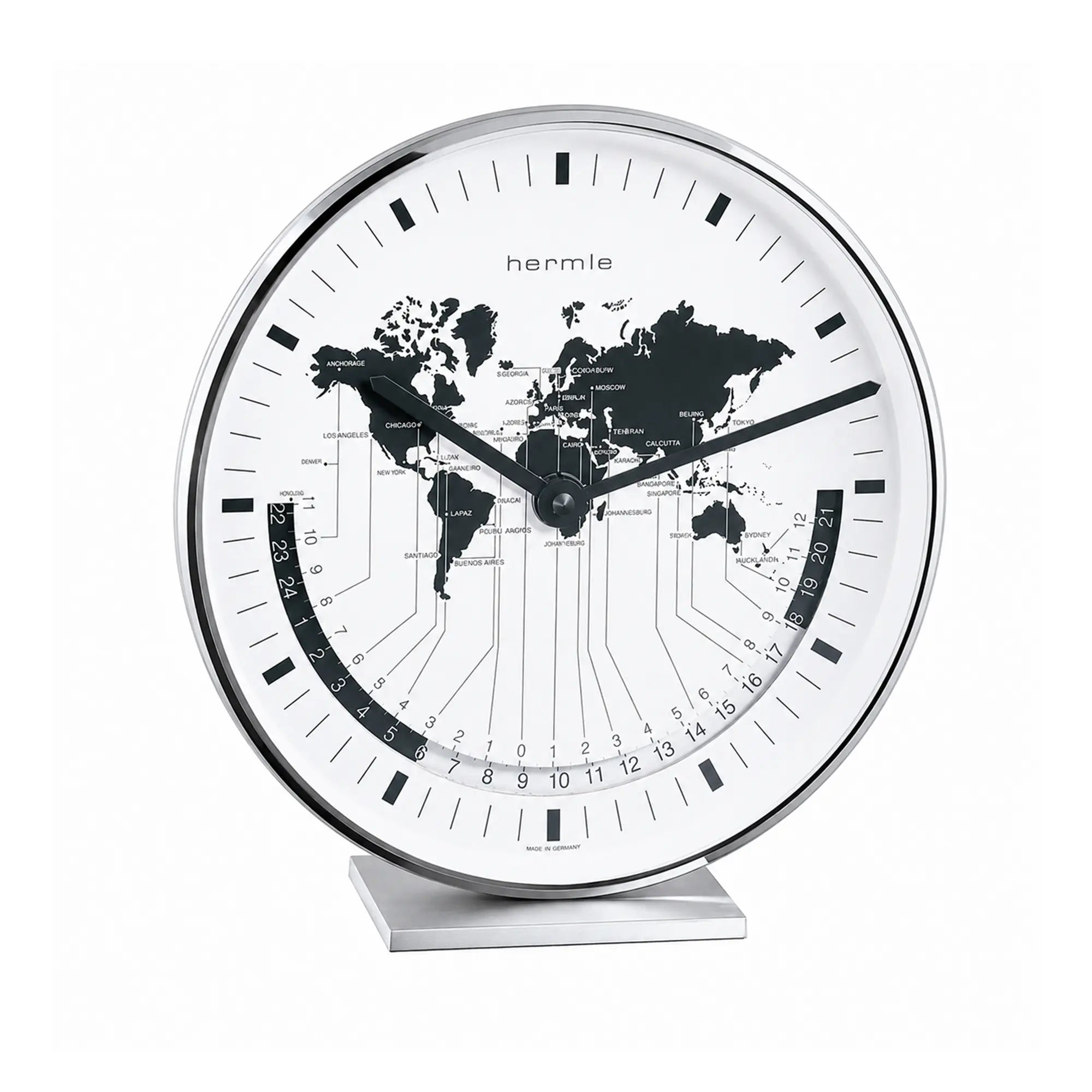 Metallic table clock with white dial and world map, black hands and scale