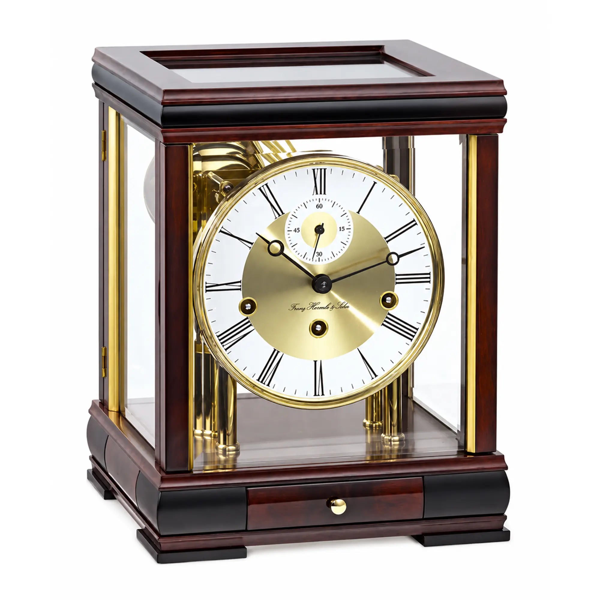 Mahogany table clock with glass frame, gold dial, and Roman numerals