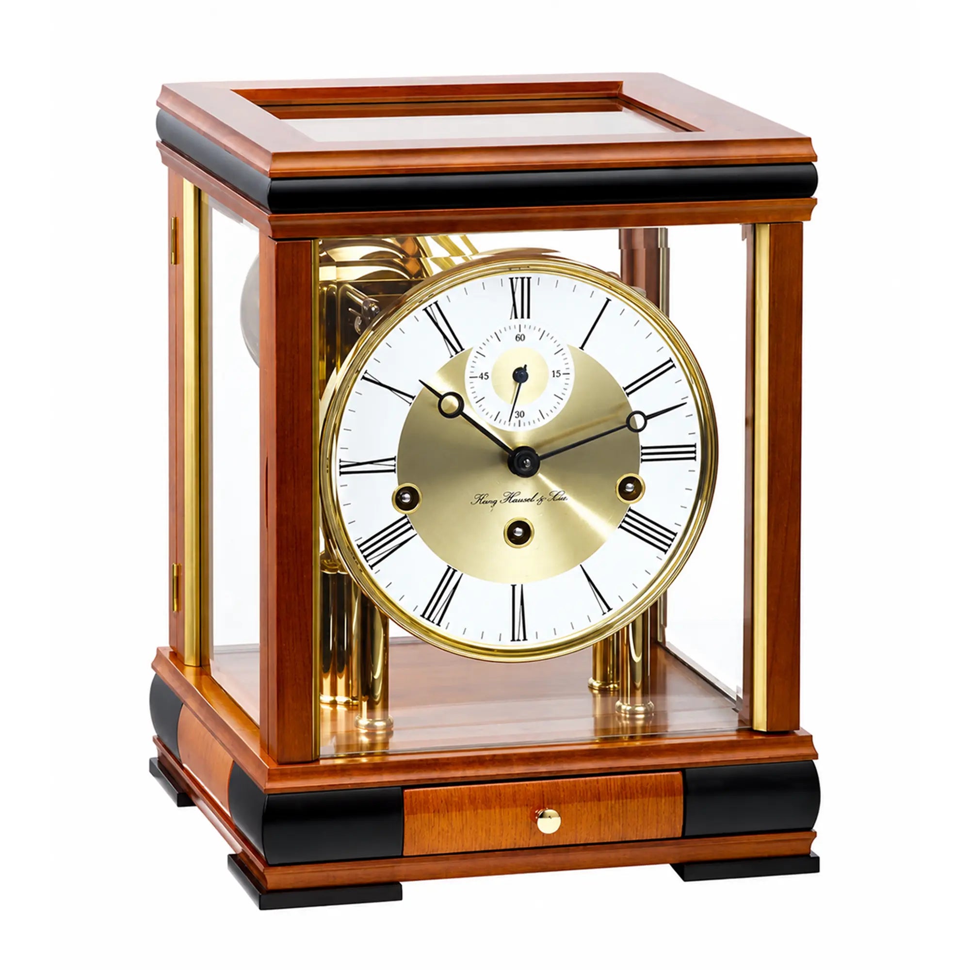 Cherry wood table clock with glass case, gold movement, and Roman numeral dial