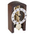 Table clock with dark wood frame, round glass dial, and visible skeleton movement
