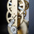 Detailed view of clockwork with gears and metal arms of a table clock