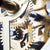 Detail of the movement: golden gears and metal components of a table clock