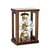 Wooden table clock with glass frame, round dial, and visible mechanical movement