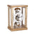 Wooden table clock with open skeleton movement, round dial, and glass frame