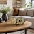 Table clock on round wooden table: wooden dial and bird melody window in black casing