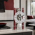 Skeleton table clock with white dial, black minute hand, and red metal struts