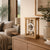Wooden table clock in glass frame with open mechanical movement and round dial