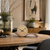 Table clock with walnut wood case and round dial, black hands and numbers.