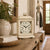 White table clock with floral dial on wooden console in living area