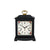 Black table clock with floral dial and gold-colored carrying handle, mechanical movement