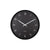Schwarze Wanduhr mit Analoganzeige, weißen Zeigern und Ziffern, rundes Gehäuse