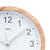 Wall clock with wood-look frame, white dial, and black numbers